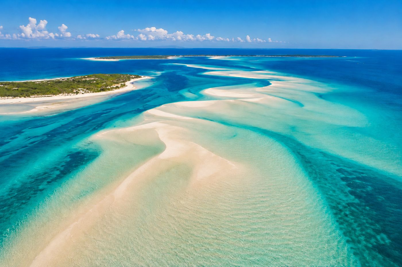 Aerial view of white sandbars and shallow turquoise channels in the Bazaruto Archipelago marine reserve, luxury Mozambique honeymoon destination, editorial travel photography