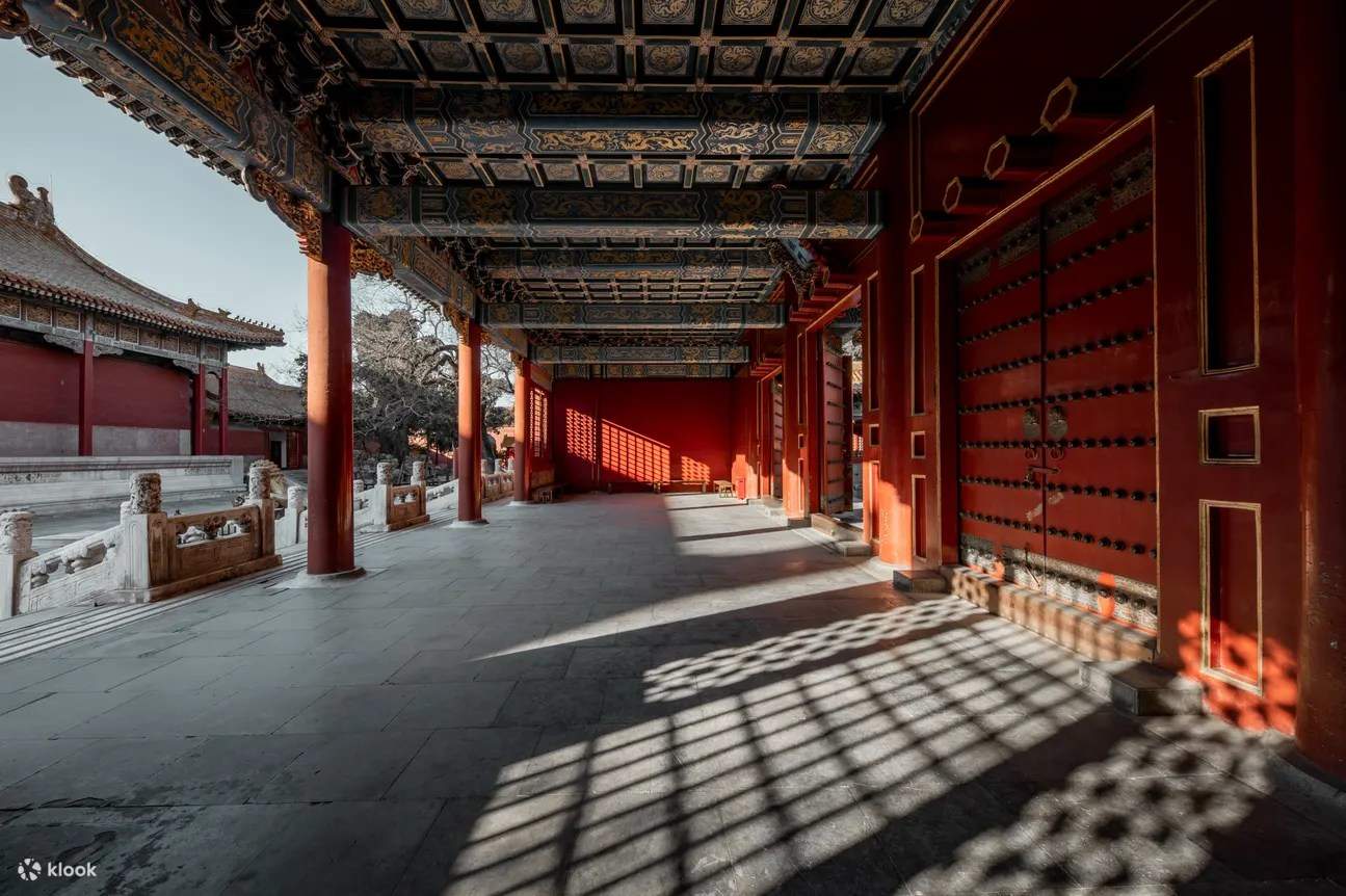 Forbidden City courtyard in Beijing at early morning with golden rooftops and empty marble walkways stretching toward distant pavilions, imperial China honeymoon, editorial travel photography