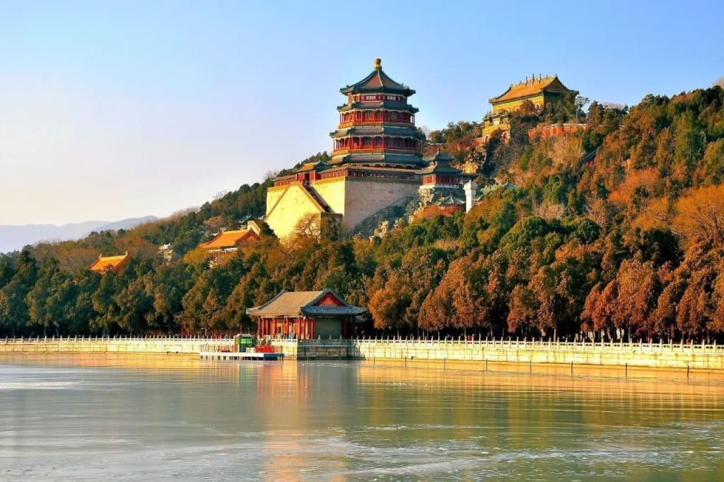 Summer Palace lakeside pavilion in Beijing with Kunming Lake reflecting willows and traditional Chinese architecture under soft afternoon light, serene honeymoon destination, editorial photography